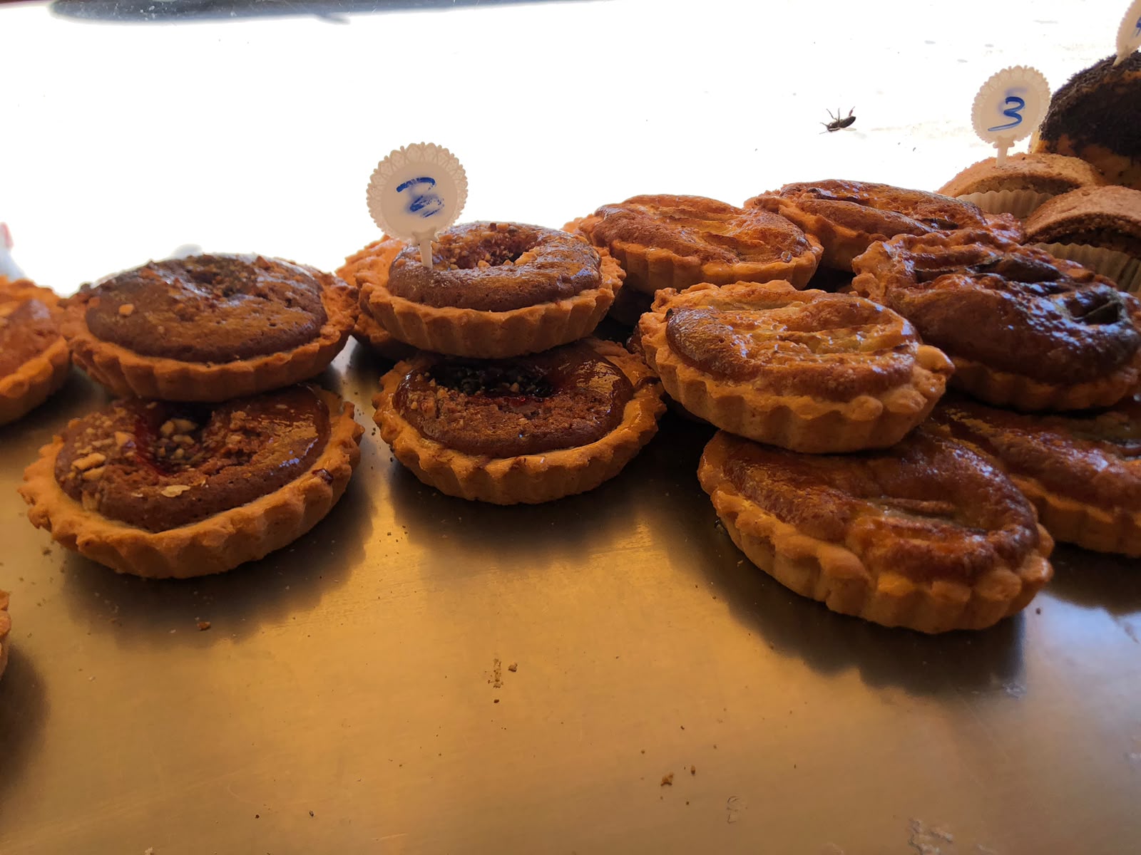 Fruit and almond tartlets on a display tray