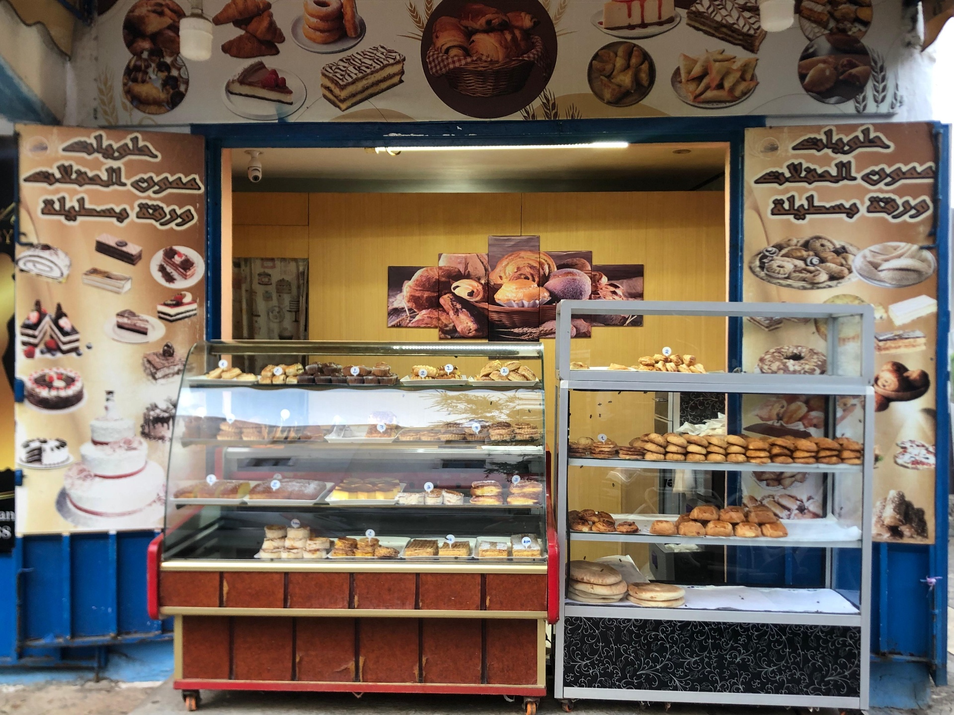 Pâtisserie Omar storefront at golden hour