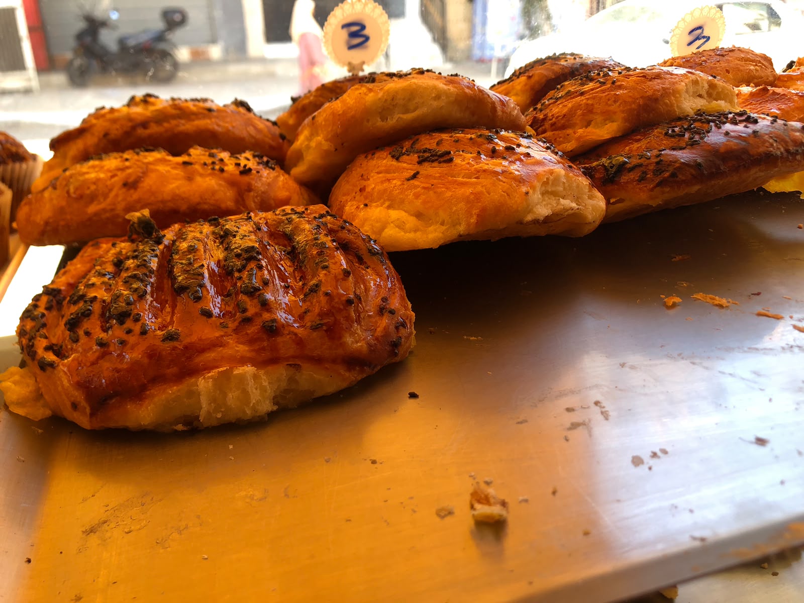 Glossy pain au chocolat with poppy seeds